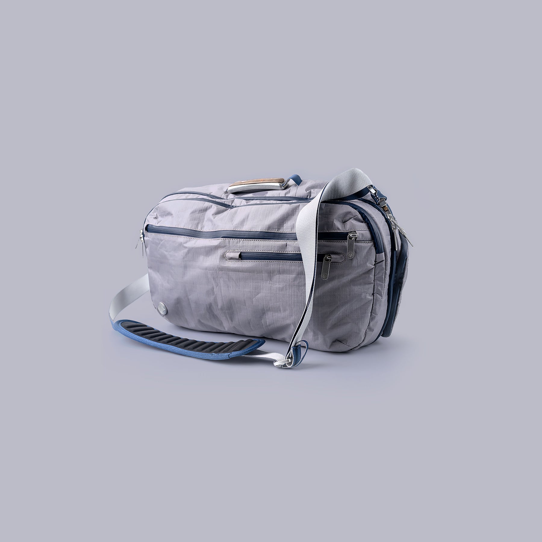 Gray Offsite bag with a strap on a light gray background