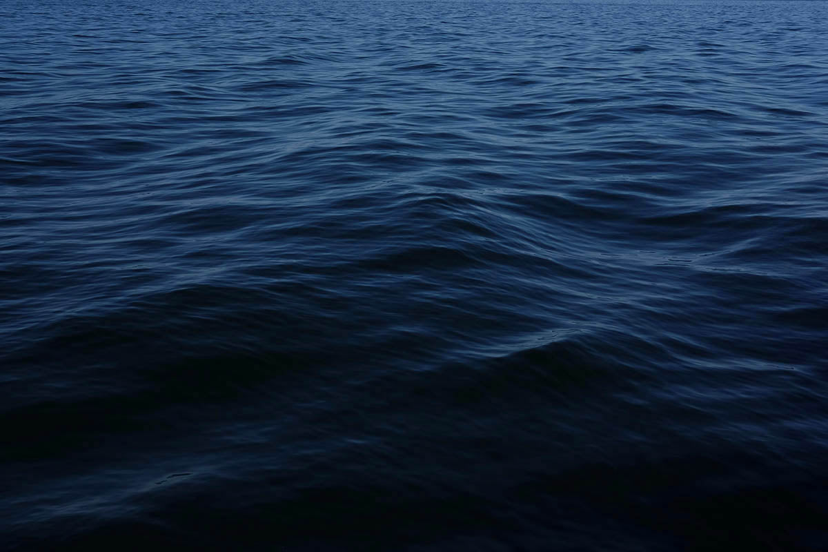 Dark blue ocean water with small waves