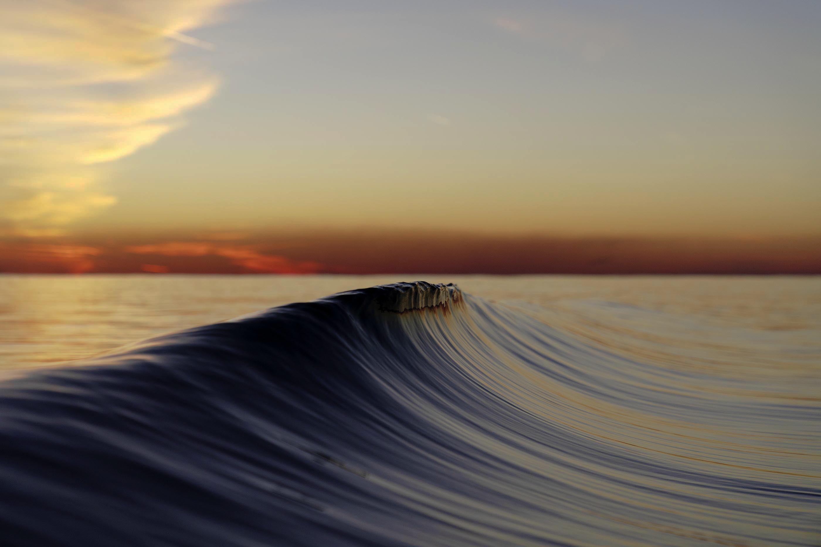 Wave at sunset with a colorful sky