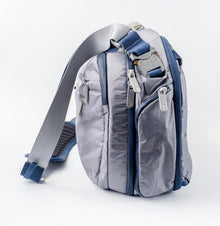 Side view of the Haze Gray Offsite Work-to-Water Dyneema® bag highlighting the zip-in, zip-out Water Preserve bottle pocket.