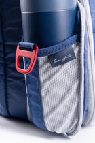 Offsite Work-to-Water Bag in Ocean blue featuring a stretch side bottle pocket with red anodized aluminum D-ring and “Live Offsite” woven label